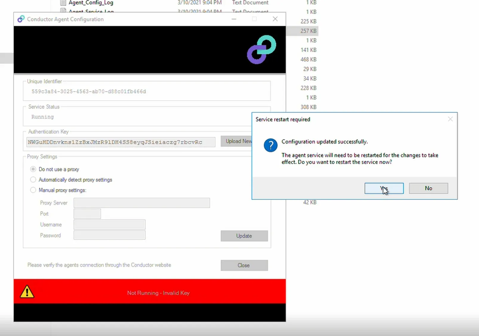 Conductor Agent Configuration window with the Authentication Key field and the Service restart required prompt, cursor on Yes